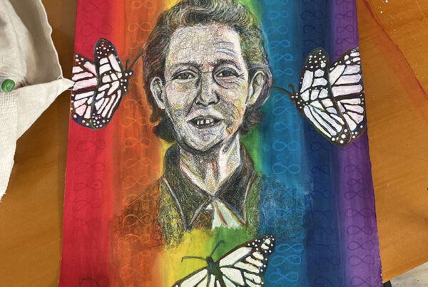 To celebrate Autism Acceptance Month, I drew a portrait of Temple Grandin with a message. The message is to promote autism ACCEPTANCE, not autism "awareness." The infinity sign pattern on a rainbow gradient behind her surrounded by butterflies represents neurodiversity.